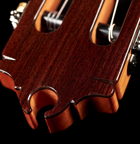 The headstock of a 2023 Hermanos Camps "GL18S" classical guitar made with spruce and Indian rosewood.