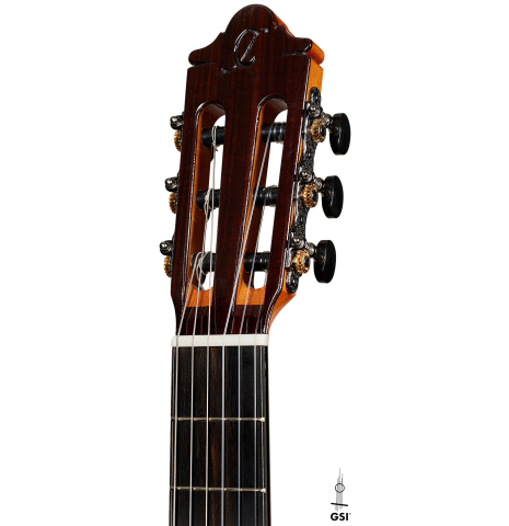The headstock of a 2024 Hermanos Camps "CL20-C" classical guitar made of cedar and Malaysian blackwood