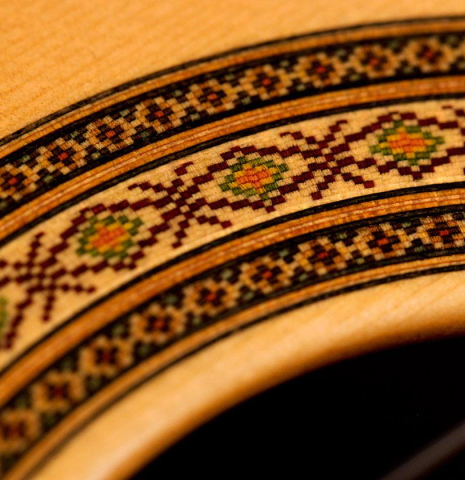 The close-up of a rosette of a 2022 Vicente Carrillo &quot;India Estudio 640&quot; made with spruce and Indian rosewood