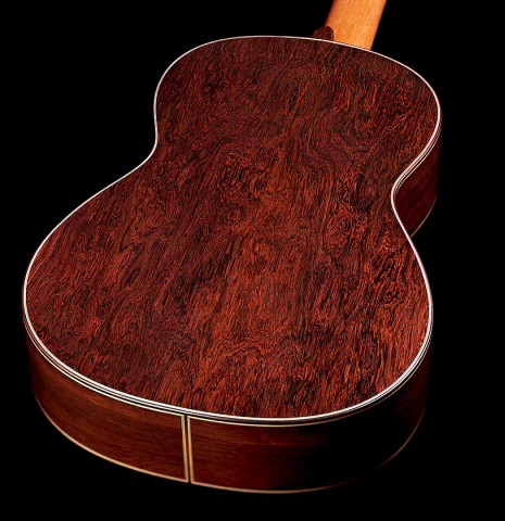 The African rosewood back of a 2021 Vicente Carrillo "Maestro Double Top" classical guitar made with cedar soundboard