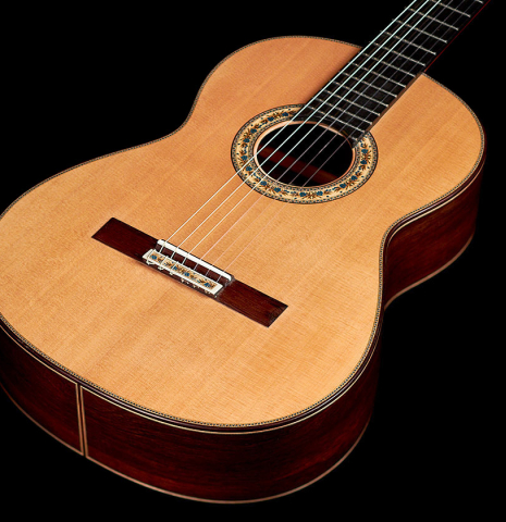 The double top soundboard of a 2021 Vicente Carrillo "Maestro Double Top" classical guitar made with cedar and African rosewood