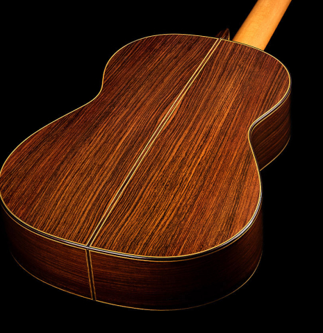 The back and sides of a 2024 Vicente Carrillo "Herencia" classical guitar made of cedar and Indian rosewood