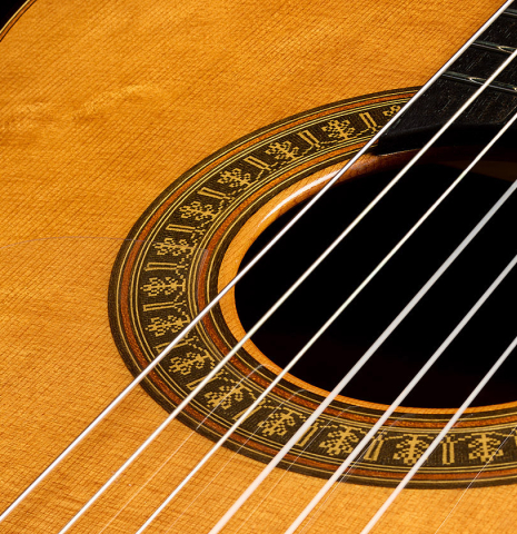 The soundboard and rosette of a 2024 Vicente Carrillo "Herencia" classical guitar made of cedar and Indian rosewood