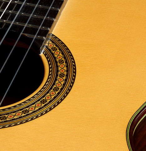 The soundboard and rosette of a 2025 Vicente Carrillo "Primera Especial" classical guitar made of spruce and Malaysian blackwood