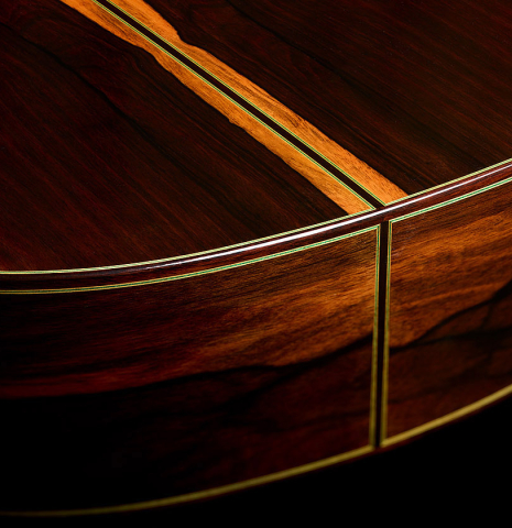The back and sides at the foot of a 2025 Vicente Carrillo "Primera Especial" classical guitar made of spruce and Malaysian blackwood