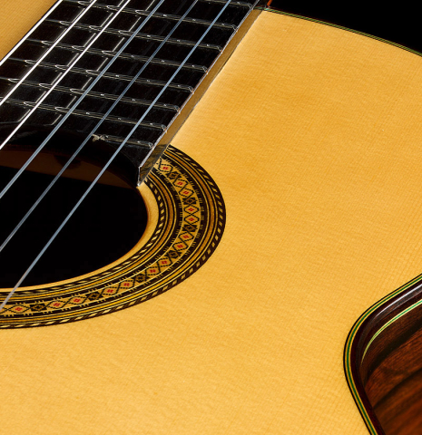The soundboard and fingerboard of a 2025 Vicente Carrillo "Primera Especial" classical guitar made of spruce and Malaysian blackwood
