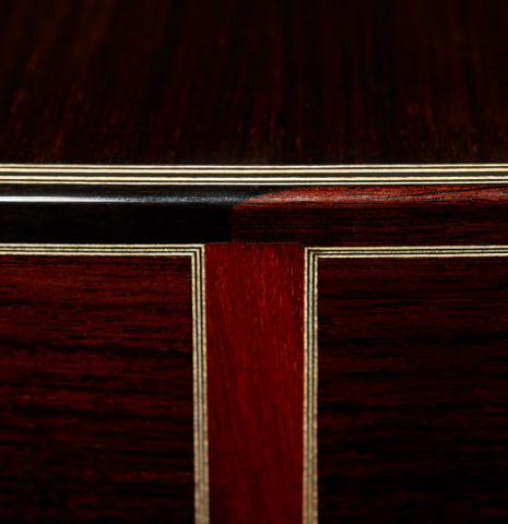 The back and sides at the foot of a 2024 Gerardo Centonze classical guitar made of spruce and Indian rosewood