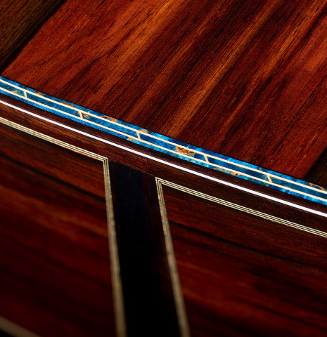 The back and sides at the foot with blue purfling of a 2026 Gerardo Centonze "The Blue Guitar" classical guitar made of spruce and African rosewood