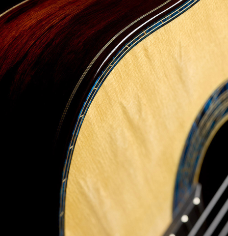 The side and top with blue purfling of a 2026 Gerardo Centonze "The Blue Guitar" classical guitar made of spruce and African rosewood