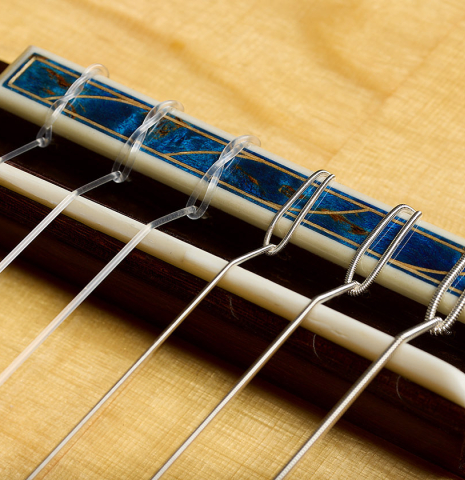 The blue tie-block of a 2026 Gerardo Centonze "The Blue Guitar" classical guitar made of spruce and African rosewood