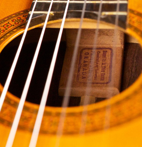 The soundhole and rosette of a 1968 Manuel de la Chica classical guitar made with spruce and CSA rosewood.