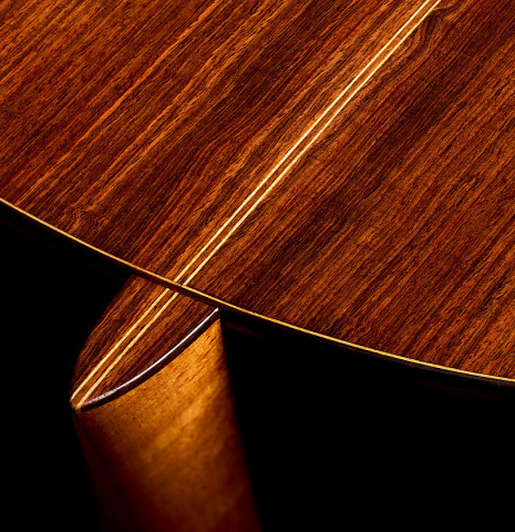 The heel, back binding and purfling of a 1969 Manuel de la Chica classical guitar made of cedar and CSA rosewood