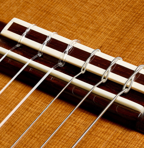 The bridge, tie-block and saddle of a 1969 Manuel de la Chica classical guitar made of cedar and CSA rosewood
