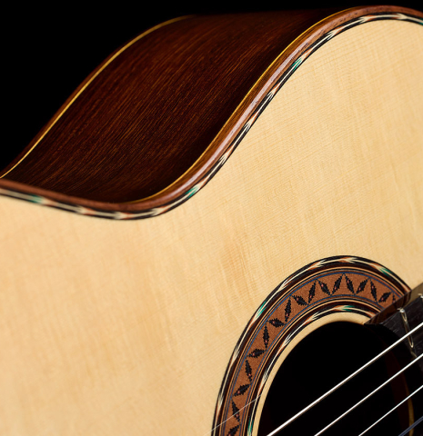 The soundboard and inlays of a 2025 Moonseok Choi classical guitar made of spruce and Indian rosewood