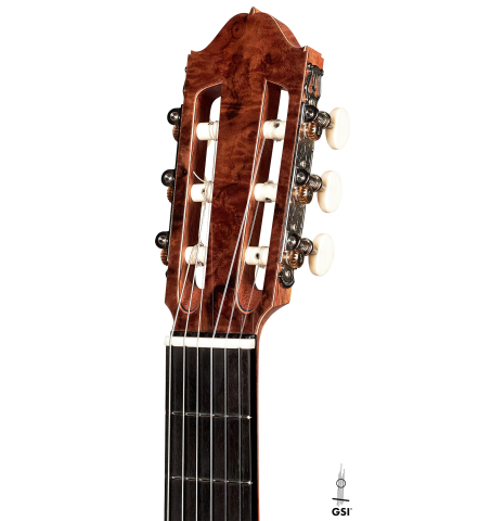 The headstock of a 2023 Moonseok Choi classical guitar made with spruce and African rosewood.