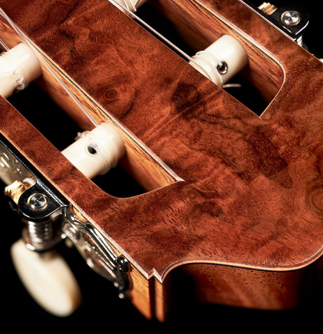 The headstock of a 2023 Moonseok Choi classical guitar made with spruce and African rosewood.