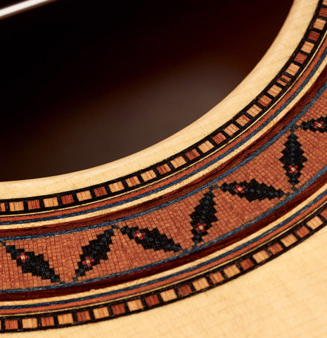 The rosette of a 2023 Moonseok Choi classical guitar made with spruce and African rosewood.