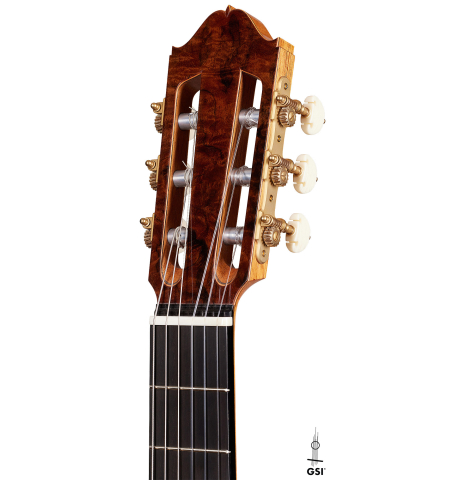 The headstock of a 2024 Moonseok Choi "Nomad" classical guitar made of spruce and African rosewood
