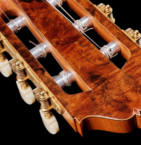 The headstock veneer and tuning machines of a 2024 Moonseok Choi "Nomad" classical guitar made of spruce and African rosewood