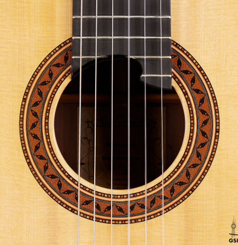 The rosette of a 2024 Moonseok Choi "Nomad" classical guitar made of spruce and African rosewood