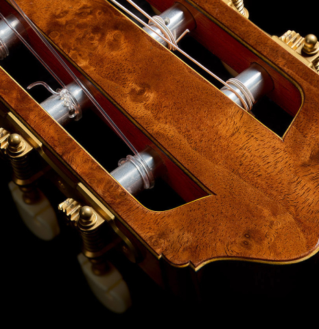 The headstock veneer of a 2025 Moonseok Choi classical guitar made of cedar and African rosewood