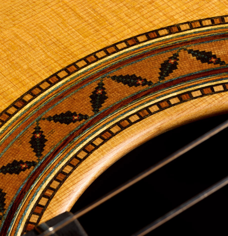 The rosette detail of a 2025 Moonseok Choi classical guitar made of cedar and African rosewood