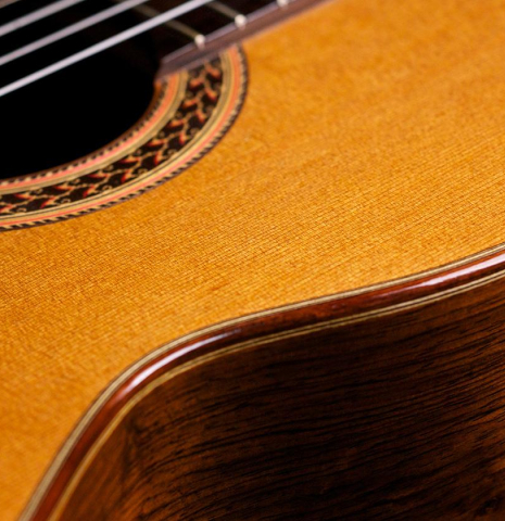 The soundboard and side of a 1982 Brian Cohen classical guitar made with cedar and CSA rosewood