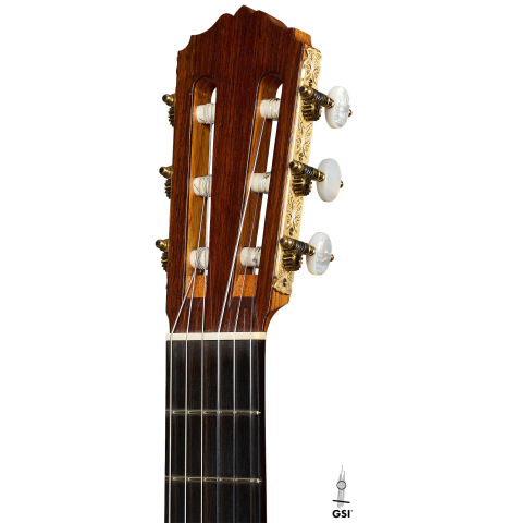 The headstock of a 1990 Brian Cohen classical guitar made of spruce and Indian rosewood