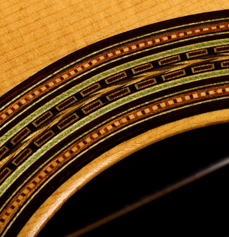 The beautiful mosaic in the rosette of a 1990 Brian Cohen classical guitar made of spruce and Indian rosewood