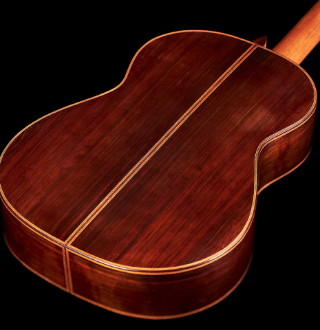 The back and neck of a 1934 Enrique Coll classical guitar made of spruce and CSA rosewood