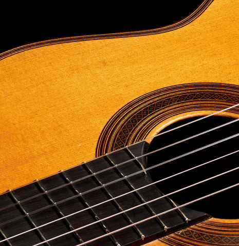 The soundboard, fretboard and rosette of a 1934 Enrique Coll classical guitar made of spruce and CSA rosewood