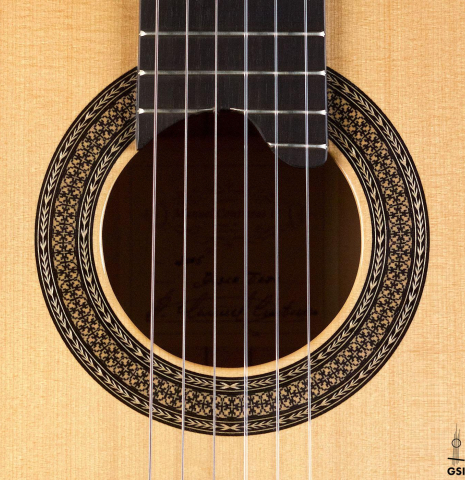 The rosette of a 2005 Manuel Contreras II "Double Top" classical guitar made of spruce and CSA rosewood