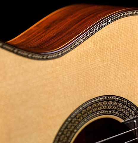 The top and side of a 2005 Manuel Contreras II "Double Top" classical guitar made of spruce and CSA rosewood