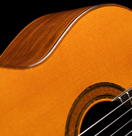The soundboard and rosette of a 1966 Manuel Contreras classical guitar made with cedar and Indian rosewood