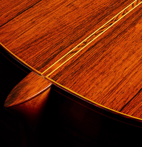 The heel, back binding and purflings of a 1973 Manuel Contreras classical guitar made of cedar and CSA rosewood