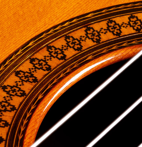 Closeup detail of the rosette of a 1973 Manuel Contreras classical guitar made of cedar and CSA rosewood