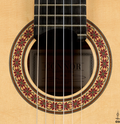 The rosette of a 2016 Stephan Connor "640" classical guitar made of spruce and koa