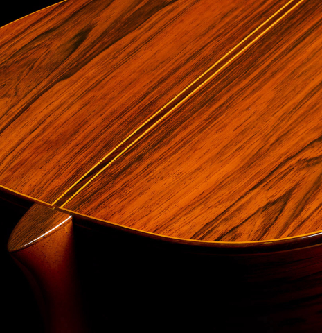 The heel, back binding and purfling of a 1986 Manuel Contreras "Double Top" classical guitar made of spruce and CSA rosewood