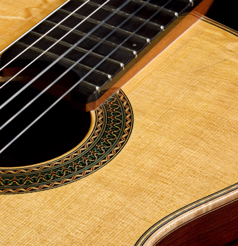 The top and rosette of a 2017 Stephan Connor "640" classical guitar made of spruce and African rosewood