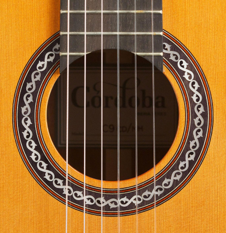 The rosette of a Cordoba "C9" classical guitar made of cedar and mahogany