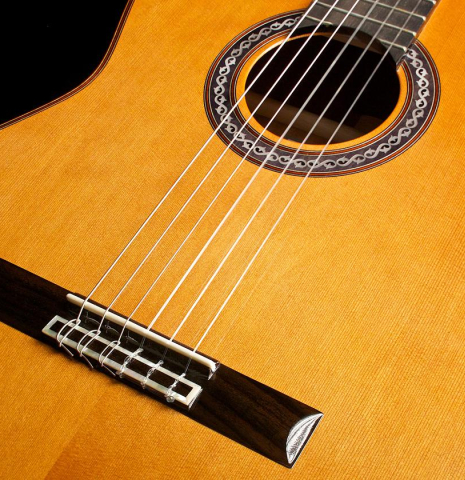 The front and bridge of a Cordoba "C9" classical guitar made of cedar and mahogany