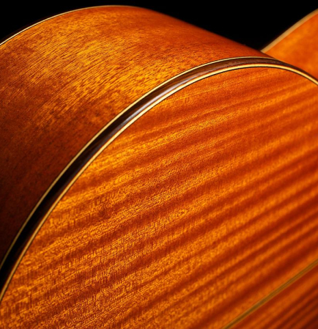 The back sides and binding of a Cordoba "C9" classical guitar made of cedar and mahogany