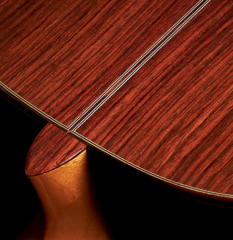 The back, heel and binding of a Cordoba Guitars Master Series "Torres" classical guitar made of spruce and Indian rosewood