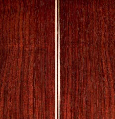 The back center seam and purfling of a Cordoba Guitars Master Series "Torres" classical guitar made of spruce and Indian rosewood