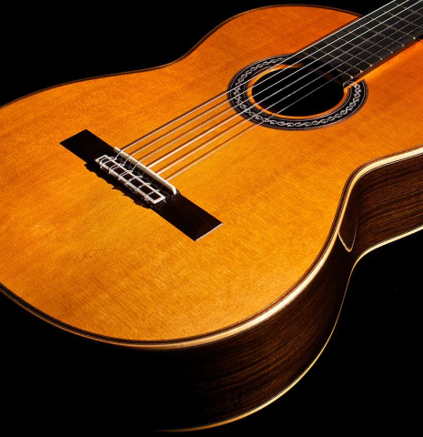 The cedar soundboard of Cordoba C12 classical guitar