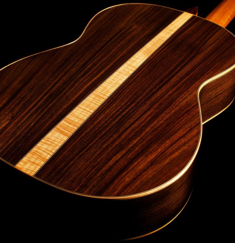 The Indian rosewood back with a maple wedge of Cordoba C12 classical guitar with the cedar soundboard