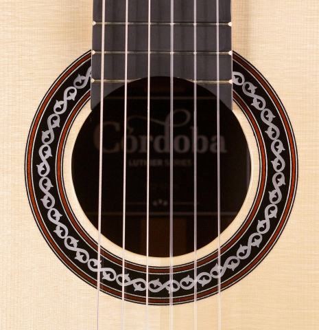 The rosette of Cordoba C12 classical guitar made with spruce and Indian rosewood