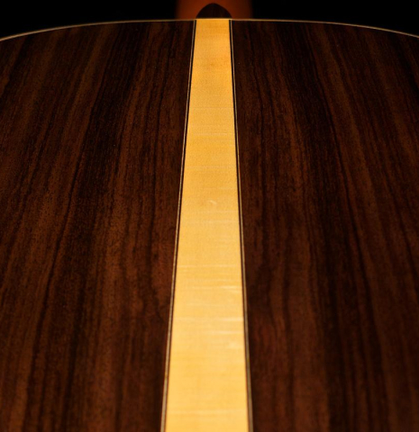The back of Cordoba C12 classical guitar made with Indian rosewood and a flamed maple wedge