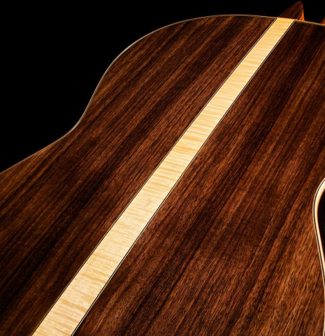 The back of Cordoba C12 classical guitar made with Indian rosewood and a flamed maple wedge