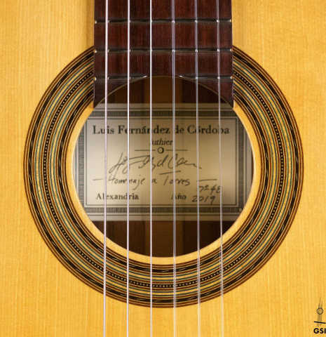 The rosette of a 2019 Luis Fernandez de Cordoba &quot;Homenaje a Torres&quot; classical guitar made with spruce and Indian laurel.